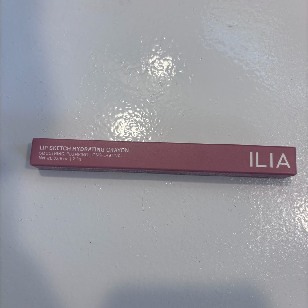 ILIA Lip Sketch Hydrating Crayon in a pink box.